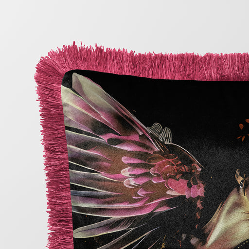 Luxury velvet cushion pillow cover of a woman with vibrant pink wings, wearing a floral dress and flower crown, set against a dark background with a butterfly motif. The pillow has a pink fringe border.