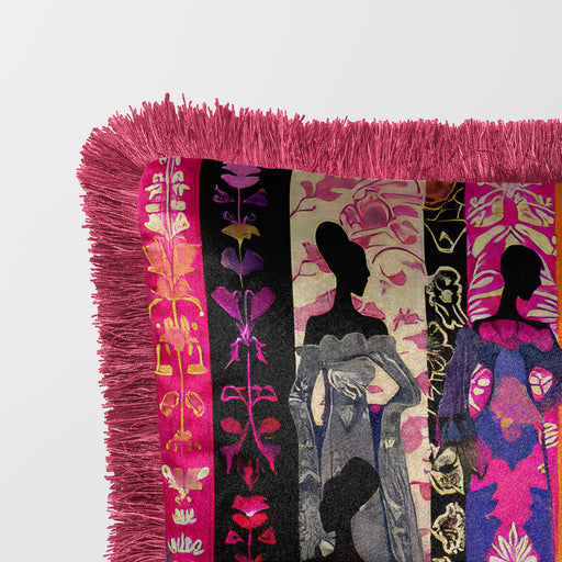 Decorative velvet luxury pillow in an eclectic bohemian style featuring silhouettes of women in vibrant, patterned dresses against vertical stripes in pink, orange, purple, and black. The pillow is bordered with a pink fringe.