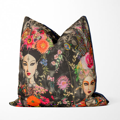 Contemporary elegant cushion pillow cover, two Indian style exquisitely adorned women with elaborate floral headdresses and intricate patterns, bursts with vivid colours of pinks, orange, green, yellow against a dramatic black background. 