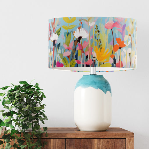 Vinrentia colourful wildflower design against a sky blue backdrop on a Extra large sized 45x25cm handcrafted fabric lampshade by artist Kelly Stevens-McLaughlan