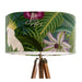 Parrots in white, green & blue along with monkeys sit amoungst green tropical leaves and pink flowers on a Extra large sized 45x25cm handcrafted fabric lampshade by artist Kelly Stevens-McLaughlan